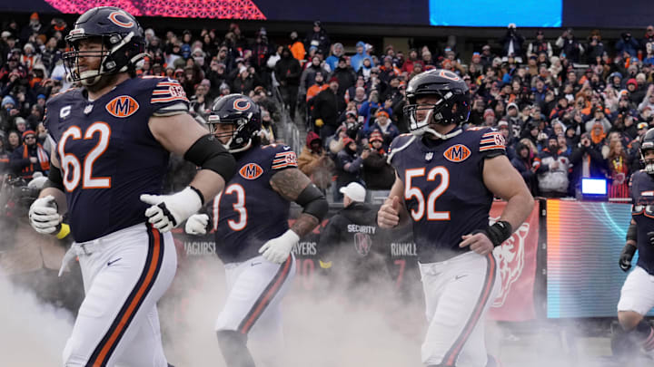 Bears offensive linemen come out together during pregame introductions. Bears offensive linemen come out together during pregame introductions.