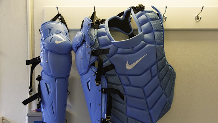 Apr 7, 2023; Milwaukee, Wisconsin, USA;  Catchers gear hangs in the Milwaukee Brewers dugout prior to the game against the St. Louis Cardinals at American Family Field. Mandatory Credit: Jeff Hanisch-Imagn Images