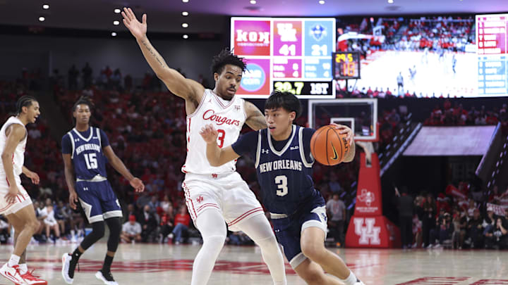 Dec 13, 2025; Houston, Texas, USA; New Orleans Privateers guard Irish Coquia (3) drives with the ball as Houston Cougars guard Ramon Walker Jr. (3) defends during the first half at Fertitta Center. Mandatory Credit: Troy Taormina-Imagn Images Dec 13, 2025; Houston, Texas, USA; New Orleans Privateers guard Irish Coquia (3) drives with the ball as Houston Cougars guard Ramon Walker Jr. (3) defends during the first half at Fertitta Center. Mandatory Credit: Troy Taormina-Imagn Images