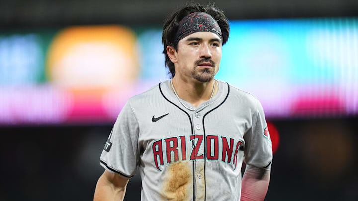 Sep 16, 2024; Denver, Colorado, USA; Arizona Diamondbacks outfielder Corbin Carroll (7) following being tagged out stealing in the third inning against the Colorado Rockies at Coors Field. Mandatory Credit: Ron Chenoy-Imagn Images