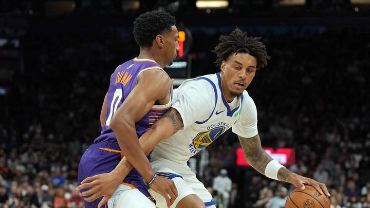 Oct 24, 2026; Phoenix, Arizona, USA; Golden State Warriors forward Yaxel Lendeborg (1) shields the ball from Phoenix Suns forward Ryan Dunn (0) in the first half at Mortgage Matchup Center. Mandatory Credit: Rick Scuteri-Imagn Images Oct 24, 2026; Phoenix, Arizona, USA; Golden State Warriors forward Yaxel Lendeborg (1) shields the ball from Phoenix Suns forward Ryan Dunn (0) in the first half at Mortgage Matchup Center. Mandatory Credit: Rick Scuteri-Imagn Images