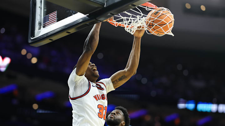 Mar 20, 2026; Philadelphia, PA, USA; Virginia Cavaliers center Ugonna Onyenso (33) dunks during the first half against the Wright State Raiders during a first round game of the men's 2026 NCAA Tournament at Xfinity Mobile Arena. Mandatory Credit: Bill Streicher-Imagn Images