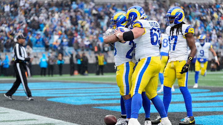 Nov 30, 2025; Charlotte, North Carolina, USA; Los Angeles Rams running back Kyren Williams (23) celebrates with Los Angeles Rams center Coleman Shelton (65) after scoring a touchdown during the fourth quarter against the Carolina Panthers at Bank of America Stadium. Mandatory Credit: Jim Dedmon-Imagn Images