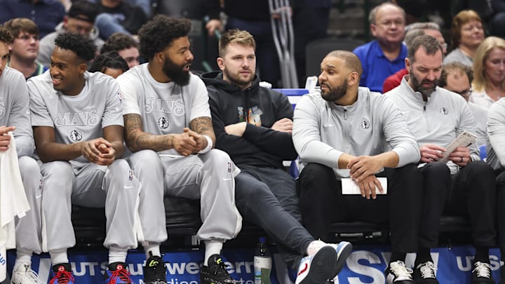 Dallas Mavericks guard Doncic sits on the bench in street clothes during the first quarter against the LA Clippers at American Airlines Center. 