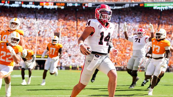 Georgia quarterback Gunner Stockton (14) runs into the end zone for a touchdown during a college football game between Tennessee and Georgia at Neyland Stadium in Knoxville, Tenn., on Sept. 13, 2025.