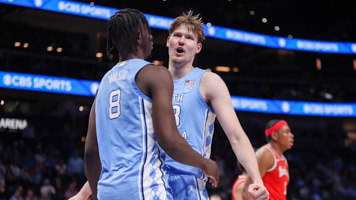 Dec 20, 2025; Atlanta, Georgia, USA; North Carolina Tar Heels forward Caleb Wilson (8) and center Henri Veesaar (13) celebrate after a basket against the Ohio State Buckeyes in the second half at State Farm Arena. Mandatory Credit: Brett Davis-Imagn Images
