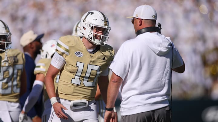 Oct 25, 2025; Atlanta, Georgia, USA; Georgia Tech Yellow Jackets quarterback Haynes King (10) and head coach Brent Key celebrate after at touchdown against the Syracuse Orange in the fourth quarter at Bobby Dodd Stadium at Hyundai Field. Mandatory Credit: Brett Davis-Imagn Images Oct 25, 2025; Atlanta, Georgia, USA; Georgia Tech Yellow Jackets quarterback Haynes King (10) and head coach Brent Key celebrate after at touchdown against the Syracuse Orange in the fourth quarter at Bobby Dodd Stadium at Hyundai Field. Mandatory Credit: Brett Davis-Imagn Images