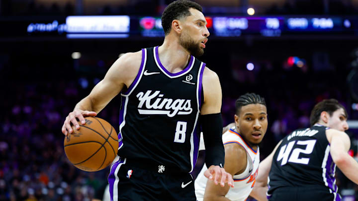 Jan 14, 2026; Sacramento, California, USA; Sacramento Kings guard Zach LaVine (8) controls the ball against New York Knicks guard Miles McBride (2) during the third quarter at Golden 1 Center. Mandatory Credit: Sergio Estrada-Imagn Images