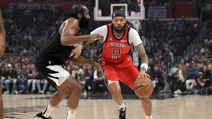 Feb 7, 2024; Los Angeles, California, USA;   Los Angeles Clippers guard James Harden (1) defends New Orleans Pelicans forward Brandon Ingram (14) in the first half at Crypto.com Arena. Mandatory Credit: Jayne Kamin-Oncea-Imagn Images