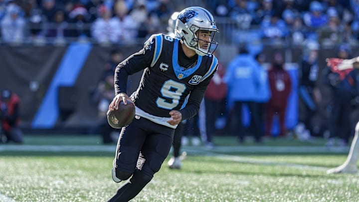 Dec 22, 2024; Charlotte, North Carolina, USA; Carolina Panthers quarterback Bryce Young (9) runs on a keeper play against the Arizona Cardinals during the second quarter at Bank of America Stadium. Mandatory Credit: Jim Dedmon-Imagn Images