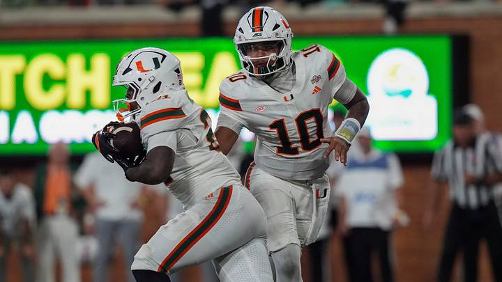 Sep 18, 2026; Winston-Salem, North Carolina, USA; Miami (FL) Hurricanes quarterback Darian Mensah (10) hands off to running back Javian Mallory (21) during the second half against the Wake Forest Demon Deacons at Allegacy Federal Credit Union Stadium. Mandatory Credit: Jim Dedmon-Imagn Images Sep 18, 2026; Winston-Salem, North Carolina, USA; Miami (FL) Hurricanes quarterback Darian Mensah (10) hands off to running back Javian Mallory (21) during the second half against the Wake Forest Demon Deacons at Allegacy Federal Credit Union Stadium. Mandatory Credit: Jim Dedmon-Imagn Images
