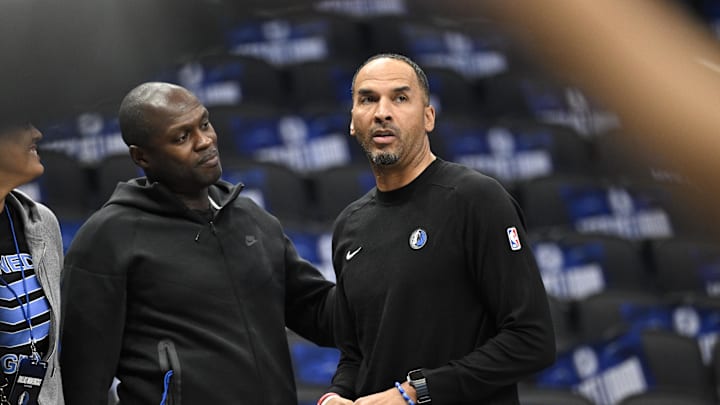 Oct 7, 2024; Dallas, Texas, USA; Dallas Mavericks general manager Nico Harrison (right) looks on during warms up before the game between the Dallas Mavericks and the Memphis Grizzlies at the American Airlines Center. Mandatory Credit: Jerome Miron-Imagn Images