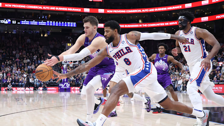 Dec 28, 2024; Salt Lake City, Utah, USA; Utah Jazz center Walker Kessler (24) and Philadelphia 76ers forward Paul George (8) battle for a loose ball during the fourth quarter at Delta Center. Mandatory Credit: Rob Gray-Imagn Images
