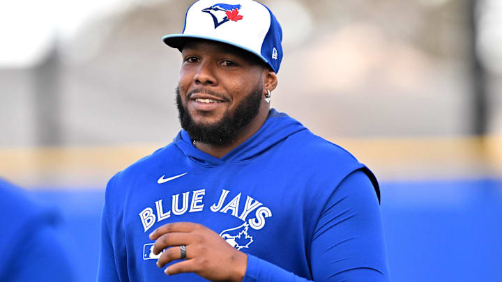 Feb 17, 2025; Dunedin, FL, USA; Toronto Blue Jays infielder Vladimir Guerrero Jr. (27) prepares for a drill during spring training at Cecil B. Englebert Complex. 