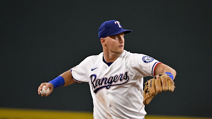 Texas Rangers third baseman Josh Jung throws to first base.