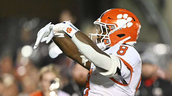 Nov 14, 2025; Louisville, Kentucky, USA;  Clemson Tigers running back Adam Randall (8) celebrates after scoring a touchdown against the Louisville Cardinals during the first half at L&N Federal Credit Union Stadium. Mandatory Credit: Jamie Rhodes-Imagn Images