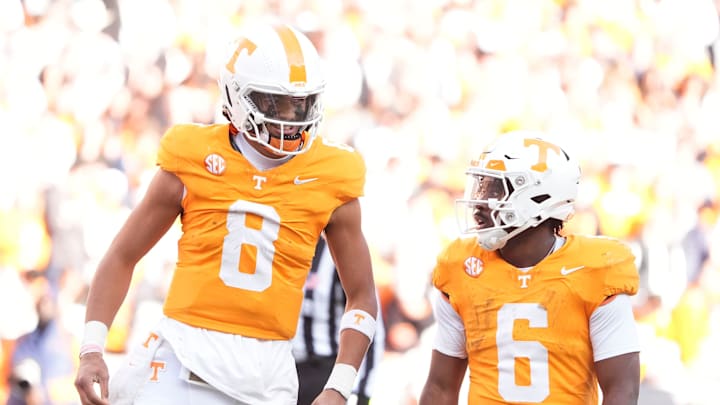 Tennessee quarterback Nico Iamaleava, left, talks with running back Dylan Sampson during a game against UTEP on Nov. 23, 2024, in Knoxville, Tenn. The Vols enjoy playoff positioning if they beat Vanderbilt in the regular-season finale.