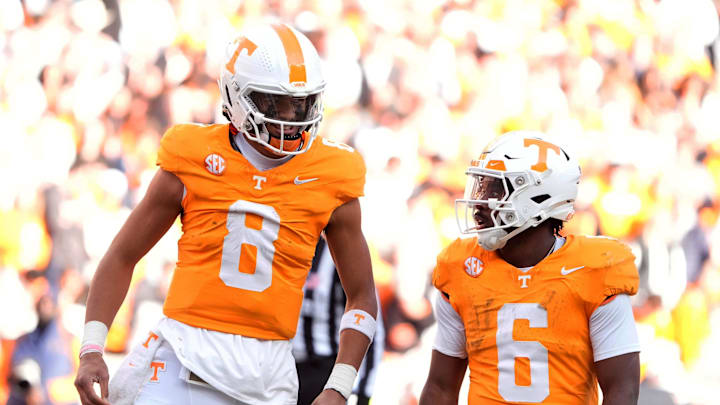Nov 23, 2024; Knoxville, Tennessee, USA; Tennessee Volunteers quarterback Nico Iamaleava (8) talks with running back Dylan Sampson (6) during a game against the UTEP Miners. Mandatory Credit: Saul Young/USA TODAY Network via Imagn Images
