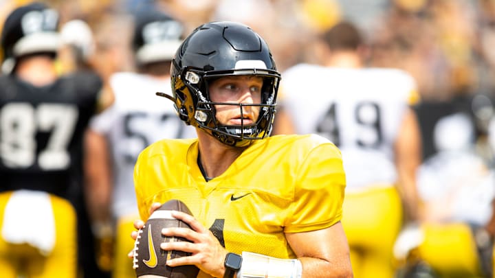 Aug 9, 2025; Iowa quarterback Mark Gronowski (11) runs a drill during the Hawkeyes Kids Day NCAA football open practice at Kinnick Stadium in Iowa City, Iowa. Mandatory Credit: Joseph Cress for the Des Moines Register Aug 9, 2025; Iowa quarterback Mark Gronowski (11) runs a drill during the Hawkeyes Kids Day NCAA football open practice at Kinnick Stadium in Iowa City, Iowa. Mandatory Credit: Joseph Cress for the Des Moines Register