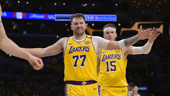 Feb 10, 2025; Los Angeles, California, USA; Los Angeles Lakers guard Luka Doncic (77) and guard Austin Reaves (15) react after a basket against the Utah Jazz at Crypto.com Arena. Mandatory Credit: Jayne Kamin-Oncea-Imagn Images