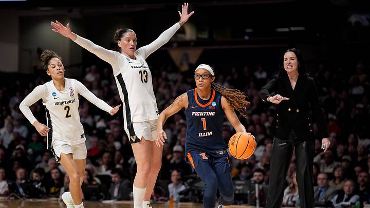 Illinois guard Aaliyah Guyton (1) moves the ball past Vanderbilt guard Justine Pissott (13) during the second half of a second round NCAA college basketball tournament game at Memorial Gym in Nashville, Tenn., Monday, March 23, 2026. Illinois guard Aaliyah Guyton (1) moves the ball past Vanderbilt guard Justine Pissott (13) during the second half of a second round NCAA college basketball tournament game at Memorial Gym in Nashville, Tenn., Monday, March 23, 2026.