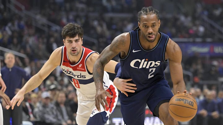  Los Angeles Clippers forward Kawhi Leonard (2) is defended by Washington Wizards forward Deni Avdija (8) in the first half at Crypto.com Arena. Mandatory Credit: Jayne Kamin-Oncea-Imagn Images