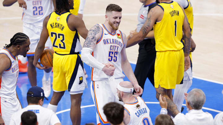 Jun 5, 2025; Oklahoma City, Oklahoma, USA; Oklahoma City Thunder center Isaiah Hartenstein (55) helps up guard Alex Caruso (9) during the fourth quarter against the Indiana Pacers during game one of the 2025 NBA Finals at Paycom Center. Mandatory Credit: Alonzo Adams-Imagn Images