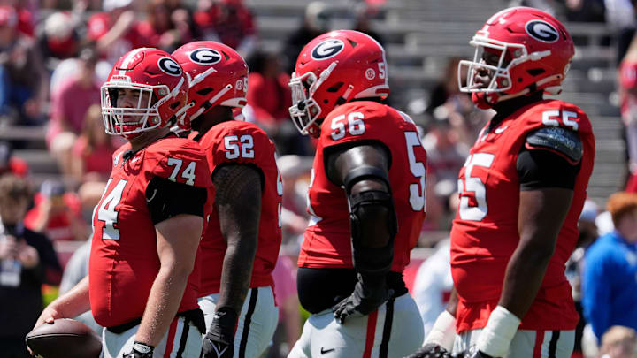 Georgia offensive lineman Drew Bobo (74) and the rest of offensive lineman get ready to run a drill during warm ups before the start of the Georgia G-Day spring football game in Athens, Ga., on Saturday, April 12, 2025.