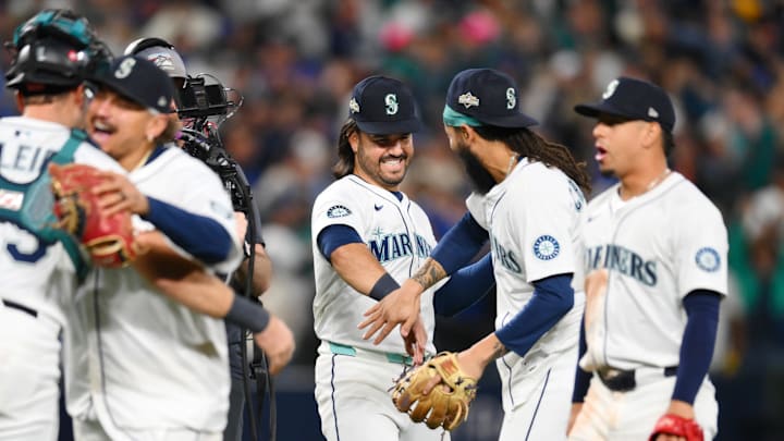 Oct 17, 2025; Seattle, Washington, USA; Seattle Mariners third baseman Eugenio Suarez (28) celebrates with shortstop J.P. Crawford (3) after their win against the Toronto Blue Jays in game five of the ALCS round for the 2025 MLB playoffs at T-Mobile Park. Mandatory Credit: Steven Bisig-Imagn Images