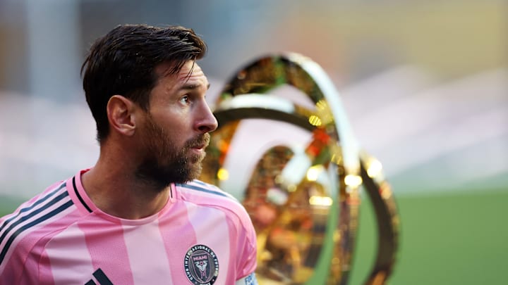 Lionel Messi, Inter Miami CF captain, walks by the FIFA Club World Cup trophy Saturday before the Herons' scoreless draw against Egyptian champions Al Ahly FC.