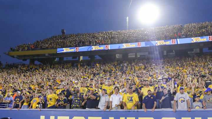 Sep 13, 2025; Morgantown, West Virginia, USA; West Virginia Mountaineers fans cheer during overtime against the Pittsburgh Panthers at Milan Puskar Stadium. Mandatory Credit: Ben Queen-Imagn Images