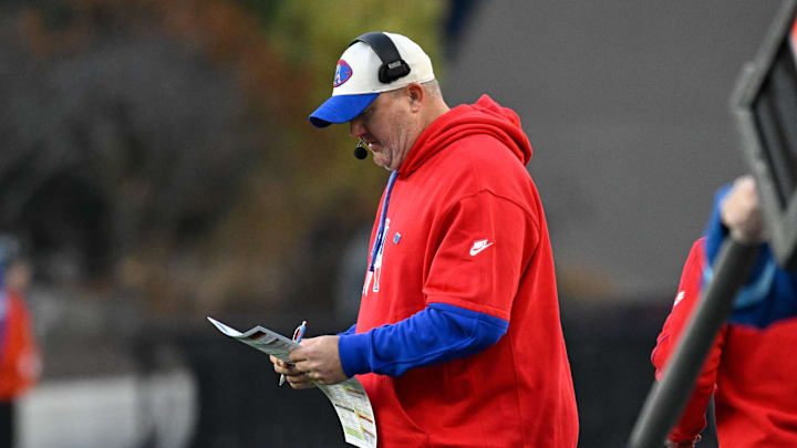 Dec 1, 2024; Foxborough, Massachusetts, USA; New England Patriots offensive coordinator Alex Van Pelt reviews the play card during the second half against the Indianapolis Colts at Gillette Stadium. Mandatory Credit: Eric Canha-Imagn Images
