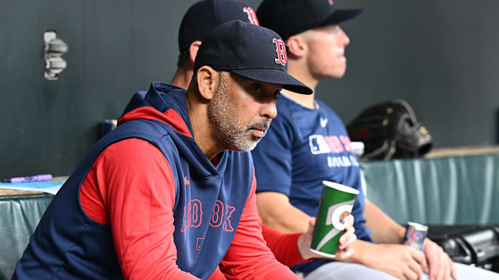 Aug 26, 2025; Baltimore, Maryland, USA; Boston Red Sox manager Alex Cora (13) sits in the dugout before the game between the Baltimore Orioles and the Boston Red Sox at Oriole Park at Camden Yards. Mandatory Credit: James A. Pittman-Imagn Images