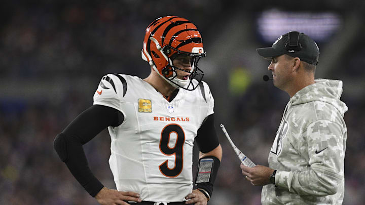 Nov 7, 2024; Baltimore, Maryland, USA; Cincinnati Bengals quarterback Joe Burrow (9) speaks with Cincinnati Bengals head coach Zac Taylor during the first quarter  against the Baltimore Ravens at M&T Bank Stadium. Mandatory Credit: Tommy Gilligan-Imagn Images