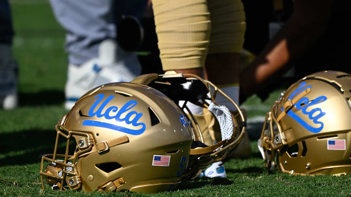 Nov 30, 2024; Pasadena, California, USA; UCLA Bruins helmets during pregame warmups before playing the Fresno State Bulldogs at Rose Bowl. Mandatory Credit: Robert Hanashiro-Imagn Images Nov 30, 2024; Pasadena, California, USA; UCLA Bruins helmets during pregame warmups before playing the Fresno State Bulldogs at Rose Bowl. Mandatory Credit: Robert Hanashiro-Imagn Images