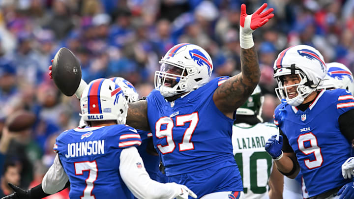 Dec 29, 2024; Orchard Park, New York, USA; Buffalo Bills defensive tackle Jordan Phillips (97) reacts to getting an interception against the New York Jets in the second quarter at Highmark Stadium. 