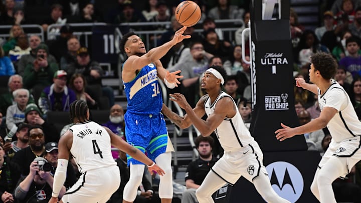 Mar 21, 2024; Milwaukee, Wisconsin, USA; Milwaukee Bucks forward Giannis Antetokounmpo (34) gets a pass away from Brooklyn Nets center Nicolas Claxton (33) and guard Dennis Smith Jr. (4) in the fourth quarterat Fiserv Forum. Mandatory Credit: Benny Sieu-Imagn Images Mar 21, 2024; Milwaukee, Wisconsin, USA; Milwaukee Bucks forward Giannis Antetokounmpo (34) gets a pass away from Brooklyn Nets center Nicolas Claxton (33) and guard Dennis Smith Jr. (4) in the fourth quarterat Fiserv Forum. Mandatory Credit: Benny Sieu-Imagn Images
