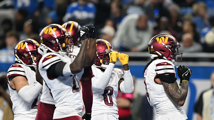 Jan 18, 2025; Detroit, Michigan, USA; Washington Commanders corner back Mike Sainristil (0) celebrates an interception against Detroit Lions during the second quarter in a 2025 NFC divisional round game at Ford Field. Mandatory Credit: Lon Horwedel-Imagn Images