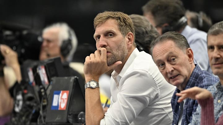 May 26, 2024; Dallas, Texas, USA; Former NBA player Dirk Nowitzki looks on in the first quarter against the Minnesota Timberwolves during game three of the western conference finals for the 2024 NBA playoffs at American Airlines Center. Mandatory Credit: Jerome Miron-Imagn Images