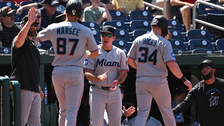 Miami Marlins manager Clayton McCullough reacts after they scored