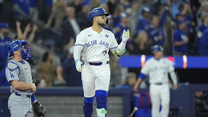 Nov 1, 2025; Toronto, Ontario, CAN; Toronto Blue Jays designated hitter Bo Bichette (11) reacts after hitting a three run home run against the Los Angeles Dodgers in the third inning during game seven of the 2025 MLB World Series at Rogers Centre. Mandatory Credit: John E. Sokolowski-Imagn Images