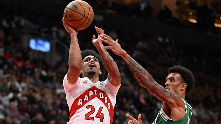 Oct 10, 2025; Toronto, Ontario, CAN; Toronto Raptors guard Chucky Hepburn (24) shoots the ball and is fouled by Boston Celtics forward Jalen Bridges (41) in the second half at Scotiabank Arena.
