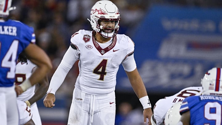 Sep 28, 2024; Dallas, Texas, USA; Florida State Seminoles quarterback DJ Uiagalelei (4) sets the play against the Southern Methodist Mustangs during the second half at Gerald J. Ford Stadium. Mandatory Credit: Jerome Miron-Imagn Images