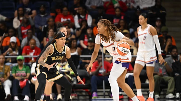 Sep 4, 2025; Washington, District of Columbia, USA; Phoenix Mercury guard Monique Akoa Makani (8) looks to dribble past Washington Mystics guard Sug Sutton (1) during the third quarter at CareFirst Arena. Mandatory Credit: Rafael Suanes-Imagn Images Sep 4, 2025; Washington, District of Columbia, USA; Phoenix Mercury guard Monique Akoa Makani (8) looks to dribble past Washington Mystics guard Sug Sutton (1) during the third quarter at CareFirst Arena. Mandatory Credit: Rafael Suanes-Imagn Images