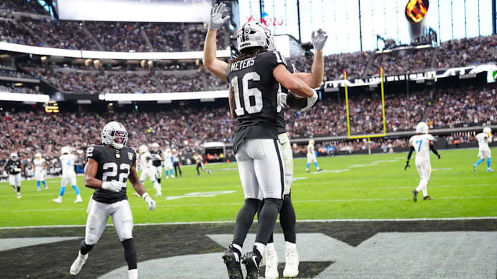 Jan 5, 2025; Paradise, Nevada, USA; Las Vegas Raiders wide receiver Jakobi Meyers (16) celebrates with Las Vegas Raiders running back Ameer Abdullah (8) and Las Vegas Raiders running back Alexander Mattison (22) after scoring a touchdown against the Los Angeles Chargers during the second quarter at Allegiant Stadium. Mandatory Credit: Stephen R. Sylvanie-Imagn Images Jan 5, 2025; Paradise, Nevada, USA; Las Vegas Raiders wide receiver Jakobi Meyers (16) celebrates with Las Vegas Raiders running back Ameer Abdullah (8) and Las Vegas Raiders running back Alexander Mattison (22) after scoring a touchdown against the Los Angeles Chargers during the second quarter at Allegiant Stadium. Mandatory Credit: Stephen R. Sylvanie-Imagn Images
