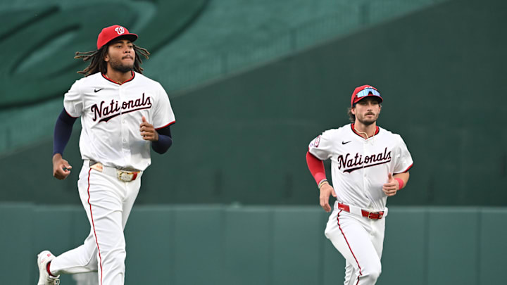 Aug 26, 2024; Washington, District of Columbia, USA; Washington Nationals left fielder James Wood (29) and center fielder Dylan Crews (3) warm up before a game against the New York Yankees at Nationals Park. Mandatory Credit: Rafael Suanes-Imagn Images