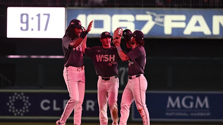 Sep 27, 2024; Washington, District of Columbia, USA;  Washington Nationals outfielders James Wood (29) and Jacob Young (30) and Dylan Crews (3) celebrate a victory against the Philadelphia Phillies at Nationals Park. Mandatory Credit: James A. Pittman-Imagn Images