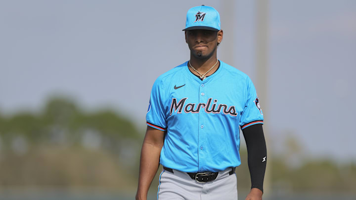 Feb 17, 2024; Jupiter, FL, USA; Miami Marlins starting pitcher Edward Cabrera (27) looks on during a