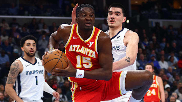 Mar 3, 2025; Memphis, Tennessee, USA; Atlanta Hawks center Clint Capela (15) collects a pass as Memphis Grizzlies center Zach Edey (14) defends during the second quarter at FedExForum. Mandatory Credit: Petre Thomas-Imagn Images Mar 3, 2025; Memphis, Tennessee, USA; Atlanta Hawks center Clint Capela (15) collects a pass as Memphis Grizzlies center Zach Edey (14) defends during the second quarter at FedExForum. Mandatory Credit: Petre Thomas-Imagn Images