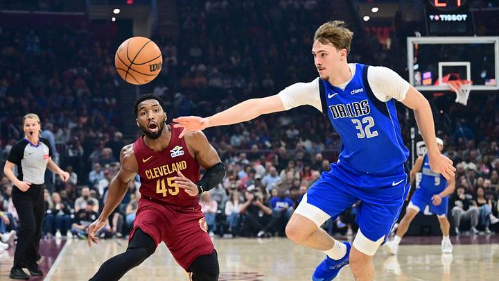 Mar 15, 2026; Cleveland, Ohio, USA; Dallas Mavericks forward Cooper Flagg (32) goes for a loose ball against Cleveland Cavaliers guard Donovan Mitchell (45) during the first half at Rocket Arena. Mandatory Credit: Ken Blaze-Imagn Images Mar 15, 2026; Cleveland, Ohio, USA; Dallas Mavericks forward Cooper Flagg (32) goes for a loose ball against Cleveland Cavaliers guard Donovan Mitchell (45) during the first half at Rocket Arena. Mandatory Credit: Ken Blaze-Imagn Images